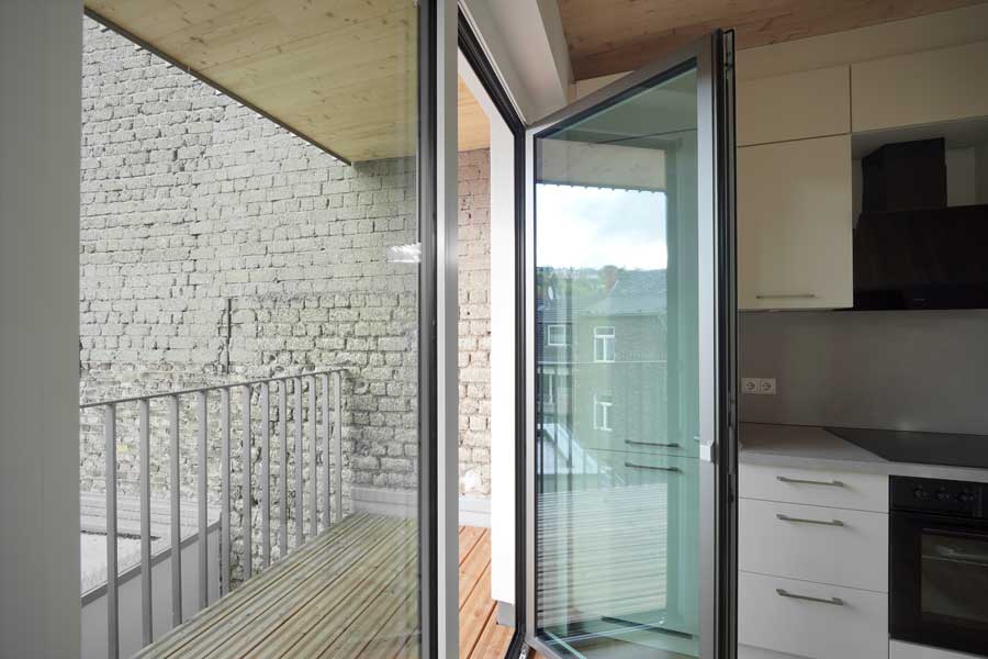 Eloxal E6 EV2, GRANODAL® C-71, E5 S-120-2 Bronzefarbene Bildfassade in Eloxal E6 C32